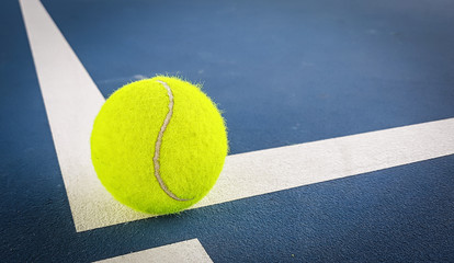 Close-up shots of tennis balls on a blue background field
