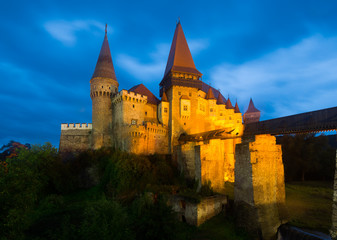 Fototapeta na wymiar Night landscape with illuminated Corvin Castle, Romania