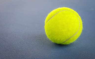 Close-up shots of tennis balls on a blue background field