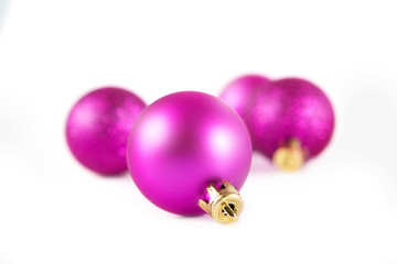 Christmas lilac balls on white background. Christmas background.