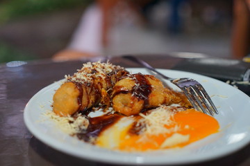 Fried bananas with chocolate, cheese and sweet