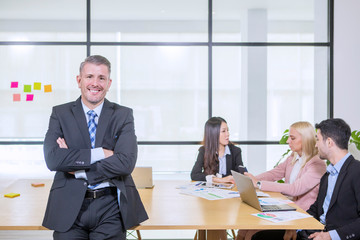 Confident caucasian manager in office