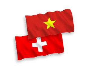 Flags of Vietnam and Switzerland on a white background