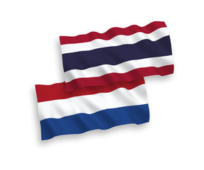 Flags of Thailand and Netherlands on a white background