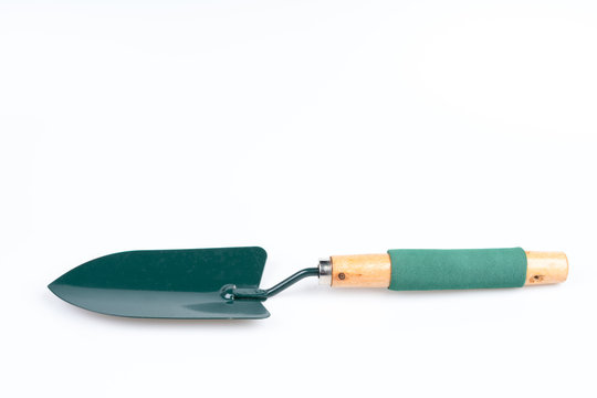 Green garden shovel with wooden handle