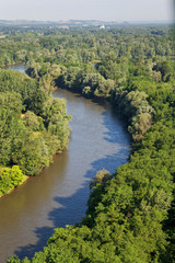 Fototapeta na wymiar The Mura River in Slovenia in its forested floodplain 