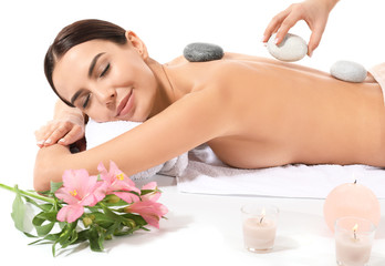 Obraz na płótnie Canvas Beautiful young woman undergoing spa treatment on white background