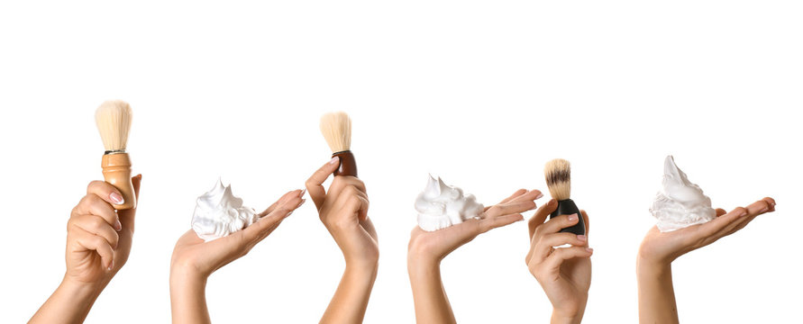 Hands With Shaving Brushes And Foam On White Background