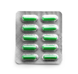 Blister pack with pills on white background