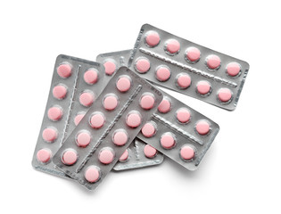 Blister packs with pills on white background
