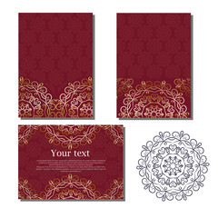 Set of cards with the image of a golden circular mandala on a burgundy background.