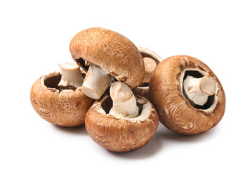 Fresh champignon mushrooms on white background