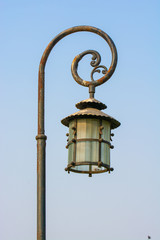 Fototapeta na wymiar Old rustic street lamp post