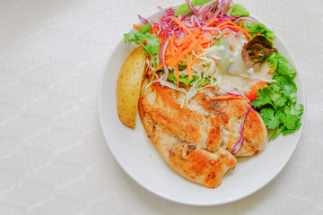 Fresh salad with chicken breast on a plate