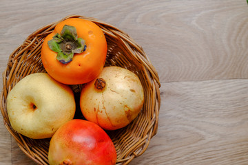 Delicious fresh bright fruits in a handmade bamboo basket
