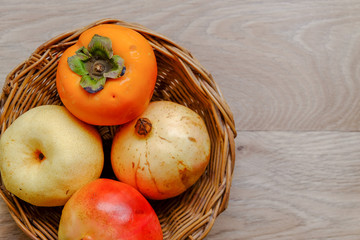 Delicious fresh bright fruits in a handmade bamboo basket