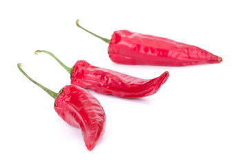 Dried red chili or chilli cayenne pepper isolated on white background cutout closeup