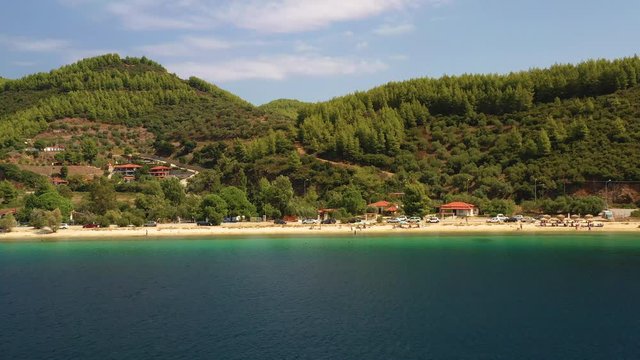 Aerial view of beautiful Porto Koufo beach with turquoise water surrounded by incredible nature. Sithonia, Chalkidiki, Greece