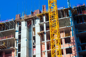 Fototapeta na wymiar The construction site. Construction of the new building. Construction cranes.