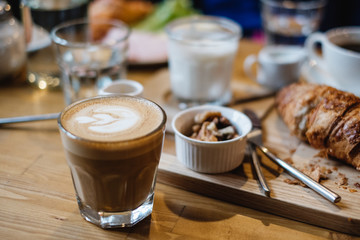 Glass with coffee on breackfast table