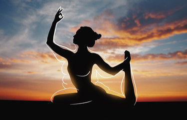 Silhouette of girl doing yoga over sunset