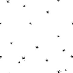 Seamless abstract pattern with black hand drawn shabby stars of different size on white background.