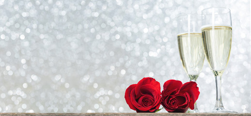 Champagne and red roses