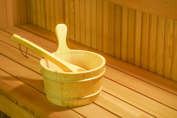 Sauna interior room. Interior details Finnish sauna steam room with traditional sauna accessories basin scoop. Relax in hot sauna.    