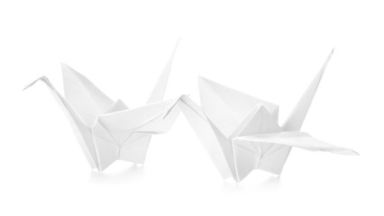 Origami cranes on white background