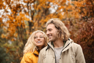 Young couple in park on autumn day