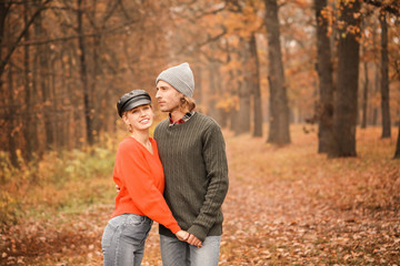 Young couple in park on autumn day