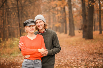 Young couple in park on autumn day