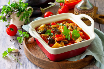 Thanksgiving Autumn Menu. Thanksgiving Autumn Menu. Stewed meat with eggplant and eggplant vegetables on a rustic table. Copy space