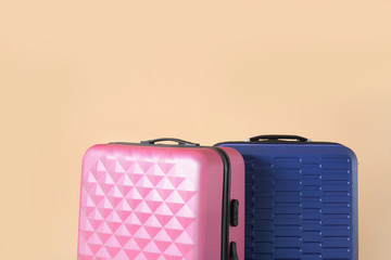 Packed suitcases on color background. Travel concept