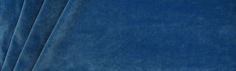Long banner velvet texture blue color background, expensive luxury fabric,  wallpaper. copy space