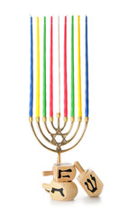Menorah and dreidels for Hanukkah on white background
