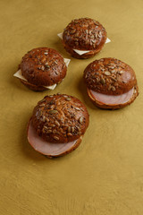 Fresh homemade burger on yellow table.