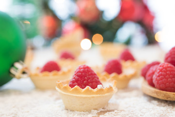 red raspberry cakes with christmas ornaments