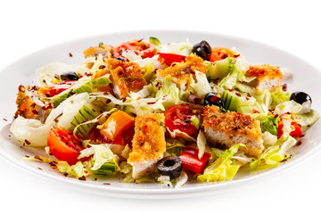 Fototapeta na wymiar Salad with chicken meat and vegetables on white background