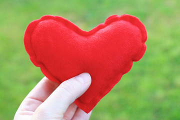 Woman holding red heart