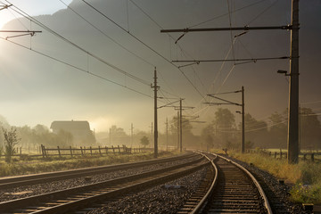 Fototapeta na wymiar Railroad tracks at sunrise from Hallstatt to Obertraun, Hallstatt, Austria