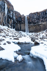 The Black Fall (Svartifoss Waterfall) in Skaftafell National park in winter time at Iceland.