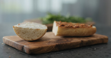 Fototapeta na wymiar ciabatta sandwich with red pesto and cream cheese on terrazzo countertop