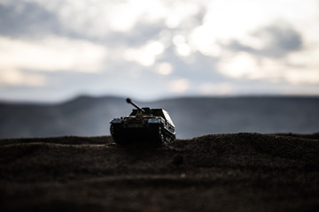 War Concept. Military silhouettes fighting scene on war fog sky background, World War German Tanks...