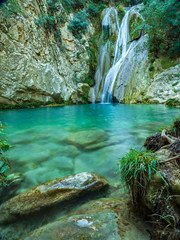 Naklejka premium Waterfall green forest river stream