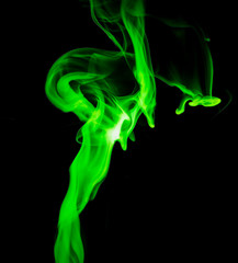 Green smoke on black background