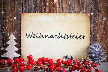 Fototapeta na wymiar Paper With German Text Weihnachtsfeier Means Christmas Party. Christmas Decoration And Wooden Background With Snow