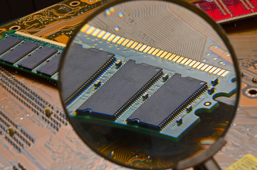 RAM chip and magnifying glass