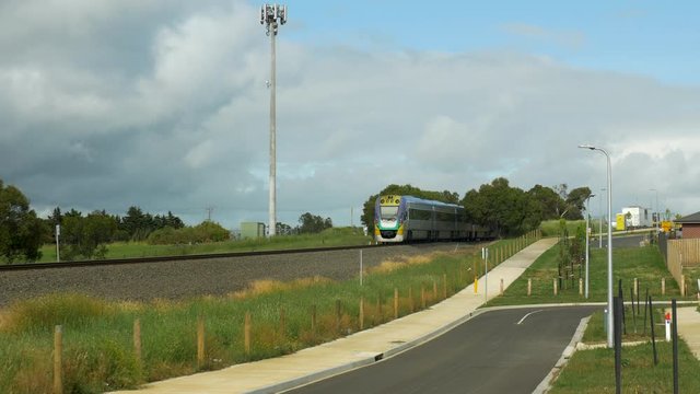 Suburban Australian Train Arriving At A Station, LOW ANGLE