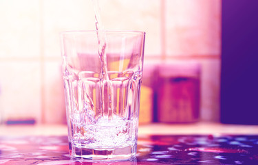 Glass of pure water on kitchen table
